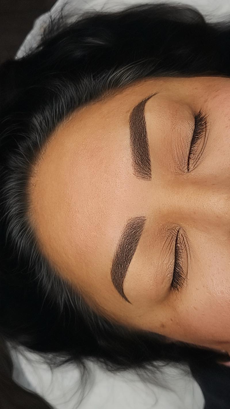 Powder brows with a soft gradient finish by Brenda Cazares, permanent makeup artist in National City. Defined, symmetrical eyebrow shape.